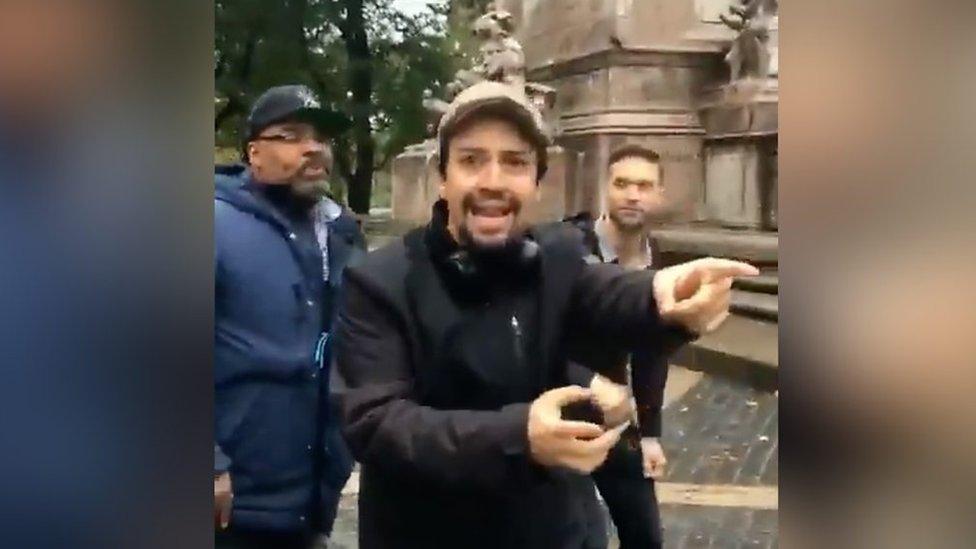 Lin-Manuel Miranda rapping in the street