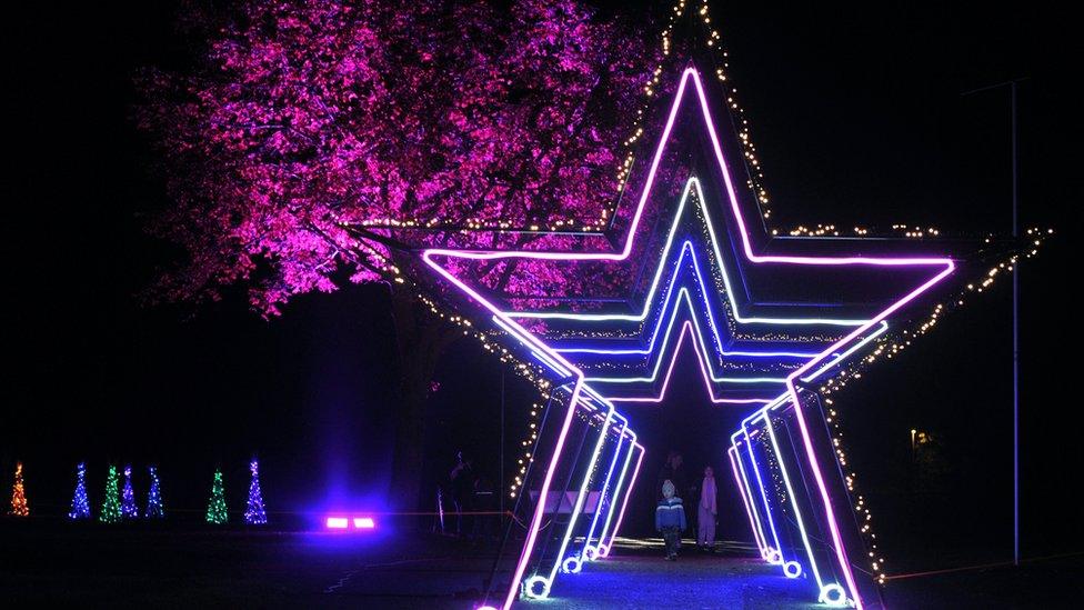 A light trail with a neon star