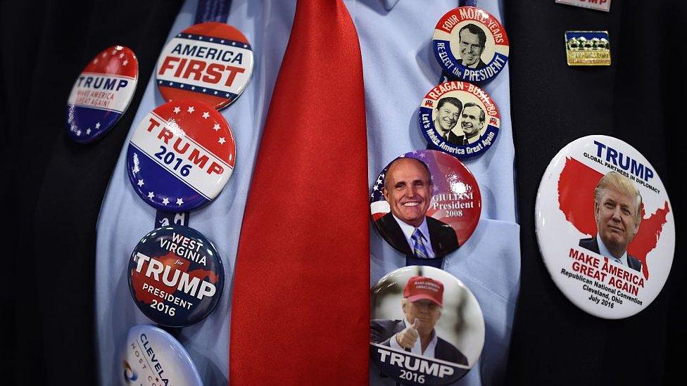 A delegates wears campaign buttons on his shirt on the first day of the Republican National Convention on July 18, 2016 at the Quicken Loans Arena