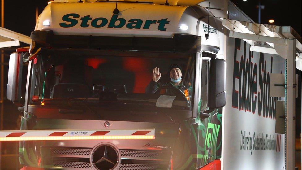 The first lorry, driven by Slavi Ivanov Shumeykov, loads onto Le Shuttle at the Eurotunnel in Folkestone, Kent, after the UK leaves the single market and customs union, and transitional trading arrangements expired at 11pm UK time