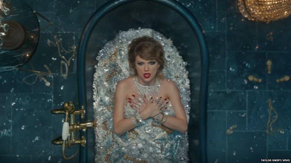 Taylor Swift in a bath of jewels