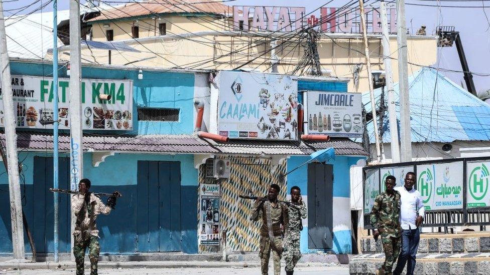 Security officers patrol near the Hyat Hotel