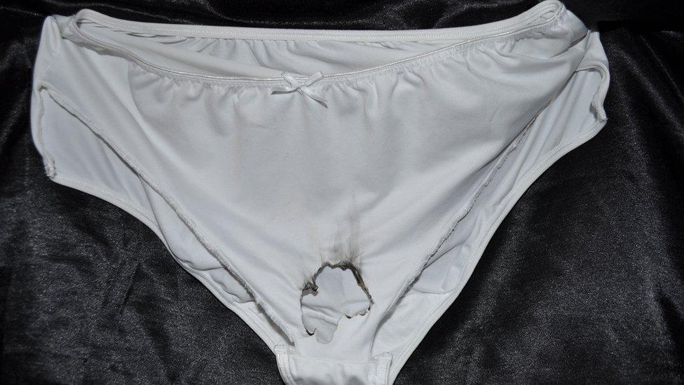 Knickers with a burnt hole at the bottom