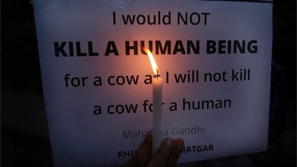 An Indian activist participates in a candle light vigil against the killing of a Muslim man in New Delhi, India, 03 October 2015.