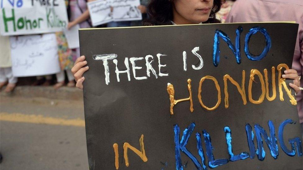 Pakistani human rights activists hold placards during a protest in Islamabad on May 29, 2014 against the killing of pregnant woman Farzana Parveen was beaten to death with bricks by members of her own family for marrying a man of her own choice in Lahore.