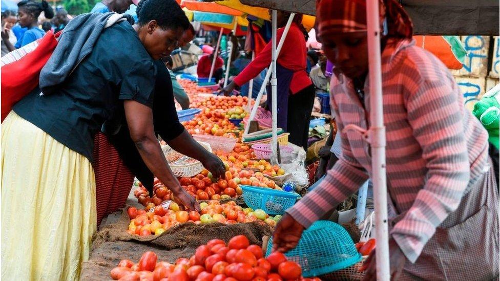 Women at a food market in Kenya