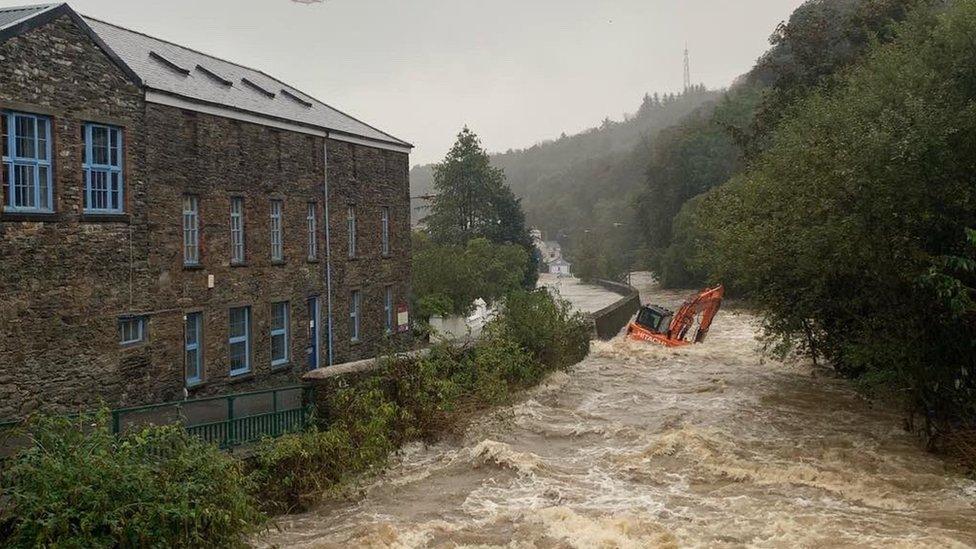 Digger in river