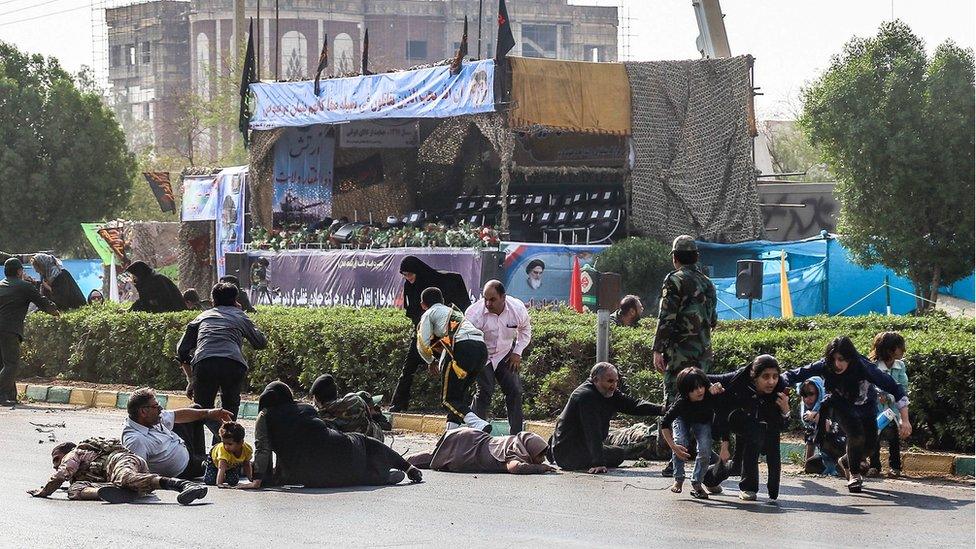 Soldiers, men, women and children running for cover during the attack