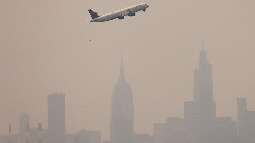 New York was barely visible in the thick smog