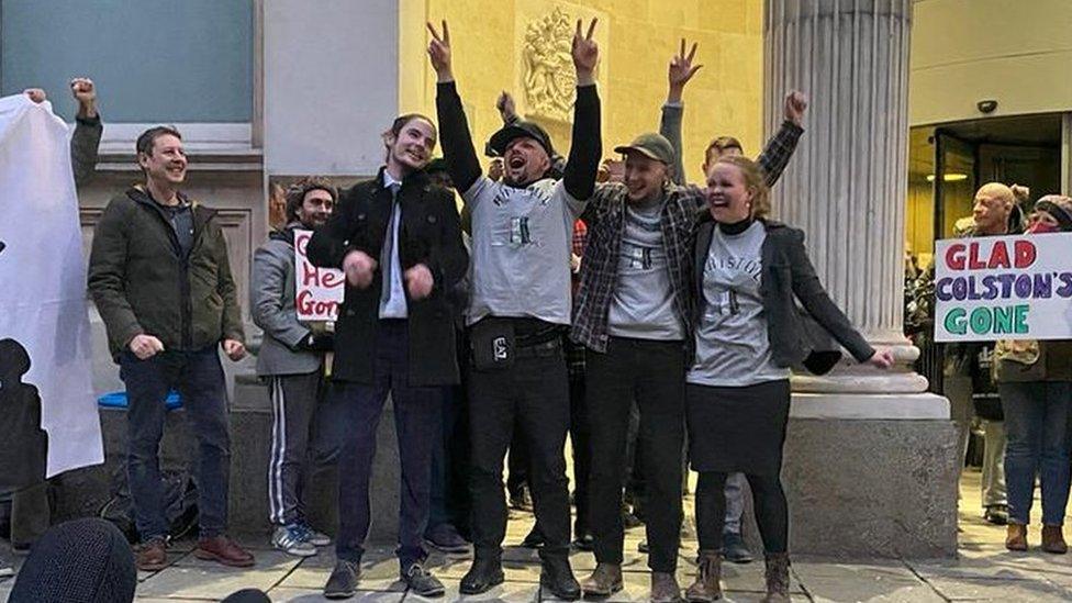 The four defendants celebrated outside the court after being found not guilty