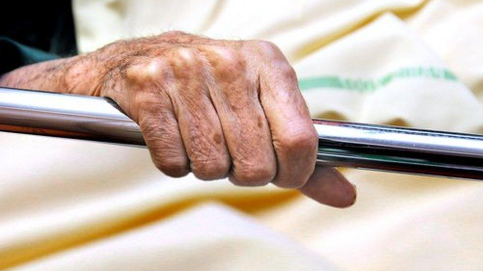 Elderly patient in a bed