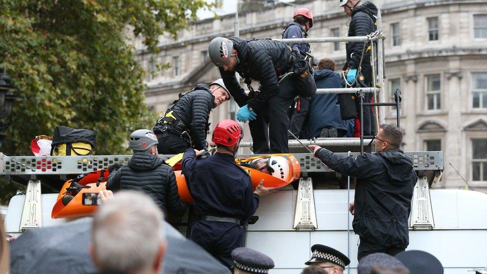 Police wearing abseiling equipment