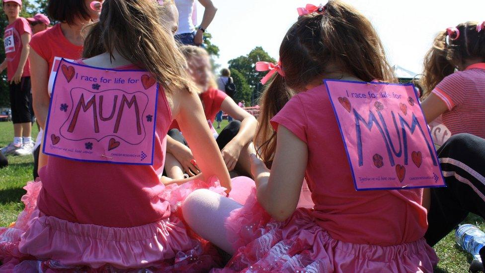 two young girls with Mum written on backs