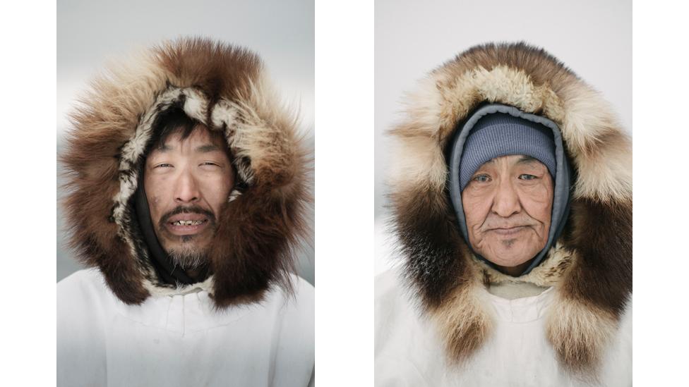 Sigvaun Kaleak and his father Raleigh, wearing traditional ice camouflage parkas