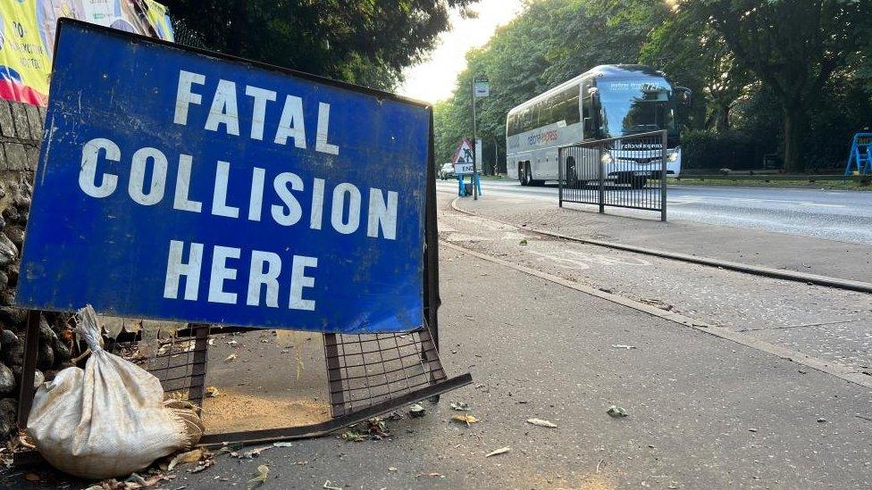 A police sign that reads "fatal collision here"