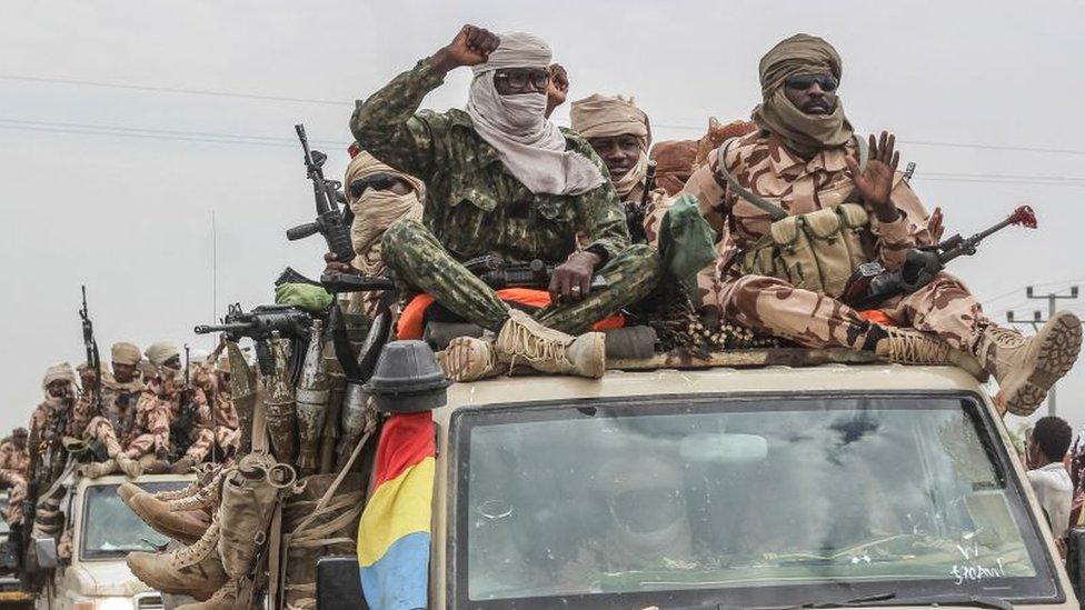 Chadian soldiers celebrate as they parade in N'Djamena on Sunday.