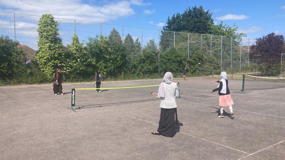 Women playing tennis