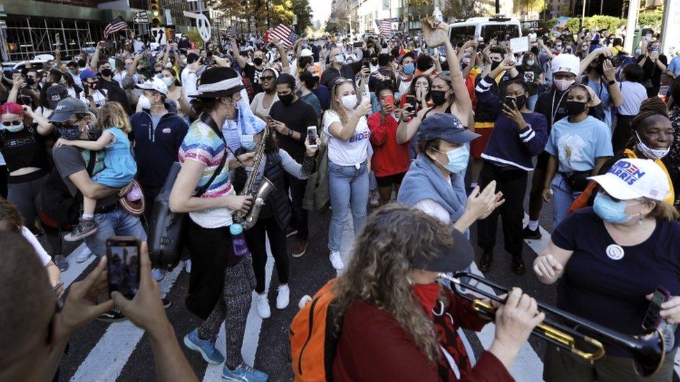 People celebrate the election of democratic candidate Joe Biden in New York