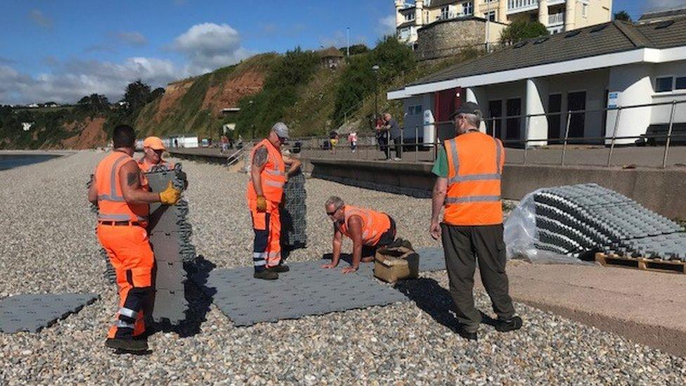 Workmen laying the track in Seaton