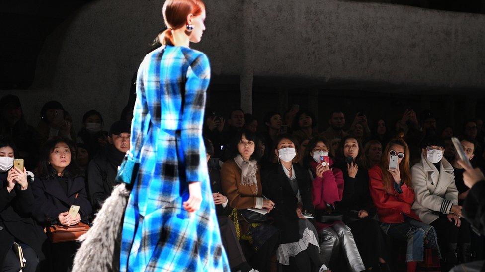 Guests at Dries Van Noten's Paris show wearing facemasks