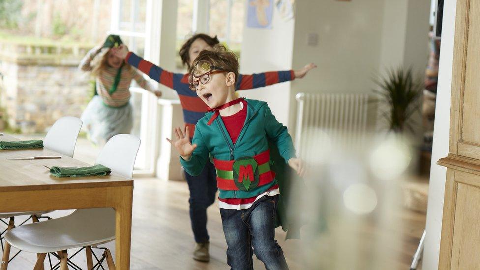 Kids playing chase dressed up