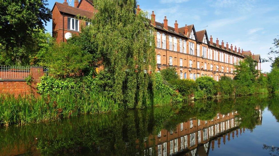 A building reflection in a canal in Coventry