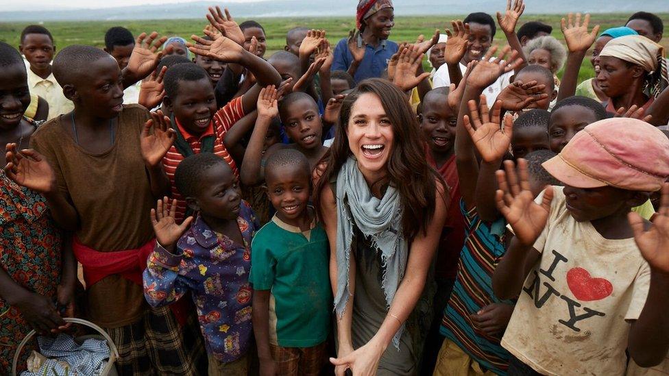 Meghan Markle surrounded by children in Rwanda during a trip with World Vision Canada