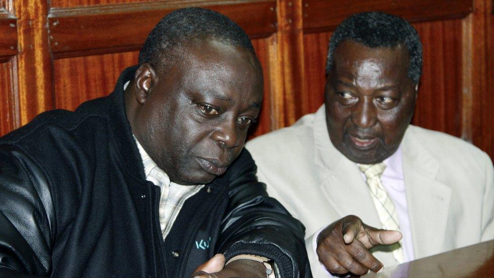 National Olympic Committee of Kenya secretary general Francis K Paul, left, and vice-chairman Pius Ochieng, right, appear at the High Court in Nairobi, Kenya