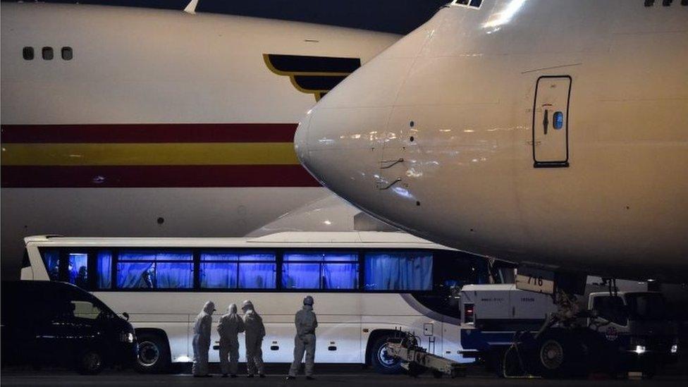 Aircraft wait to take Americans home from Japan after they were taken off the quarantined cruise ship, Diamond Princess, 17 February 2020