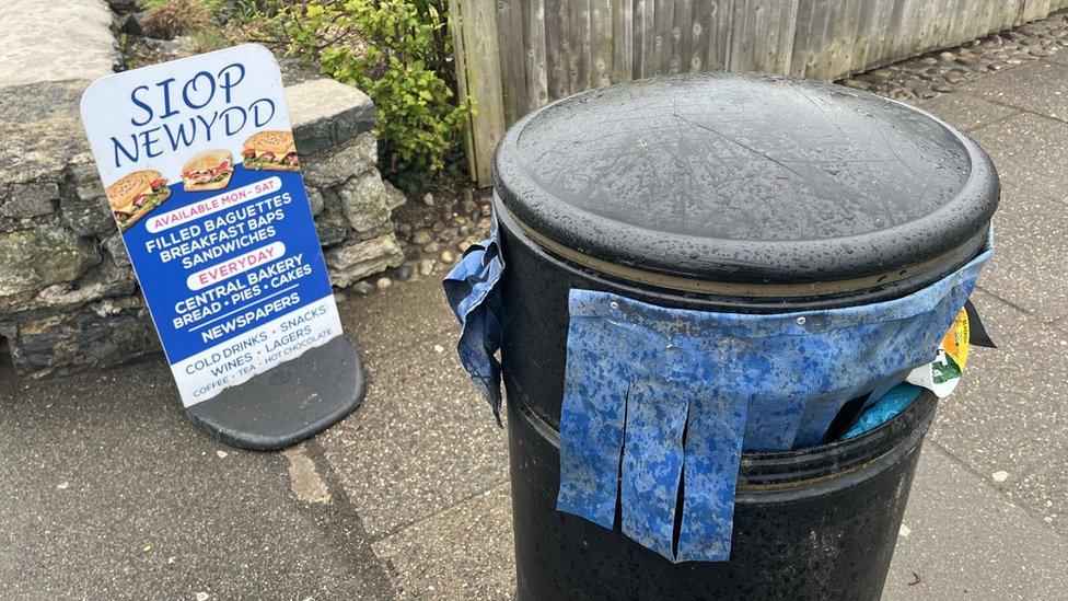 Bin with curtains