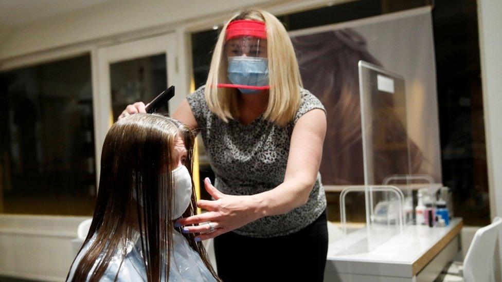 woman-getting-hair-cut.