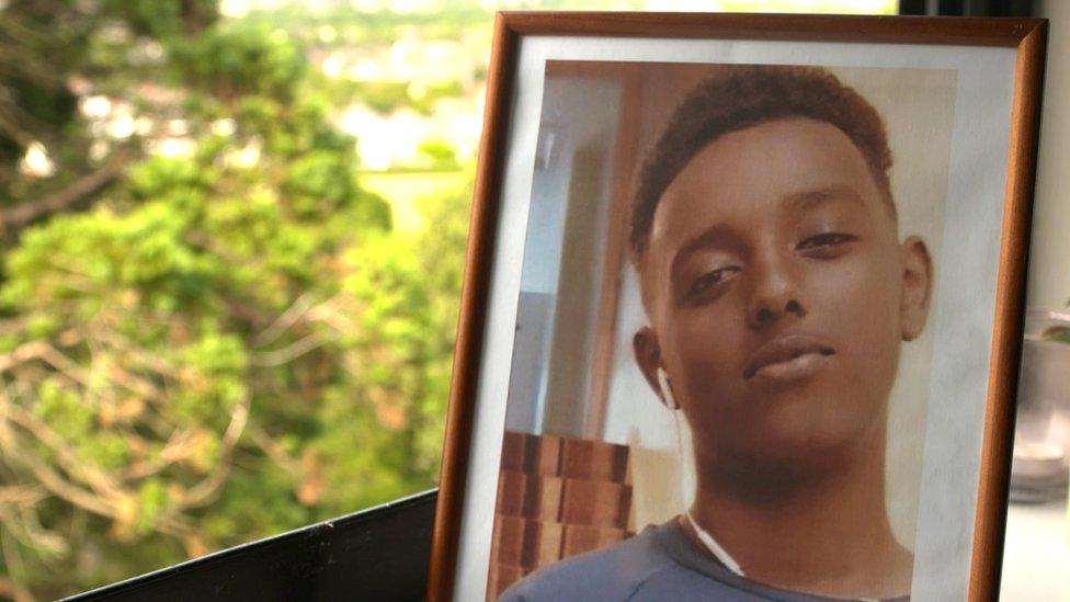 A picture in a frame of teenager Fahad Mohamed Nur who died after being stabbed in Cardiff