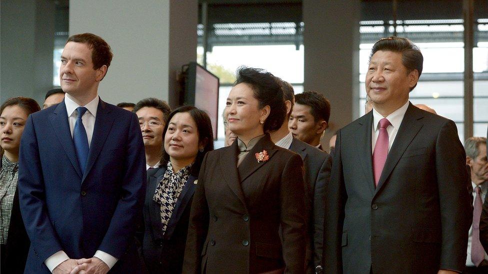 George Osborne, left, stands with China's President Xi Jinping, right, his wife Peng Liyuan, centre