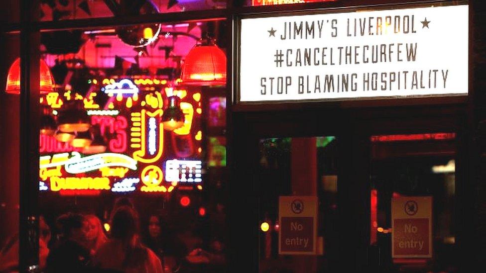 Sign reading "Jimmy's Liverpool - Cancel The Curfew - Stop Blaming Hospitality"