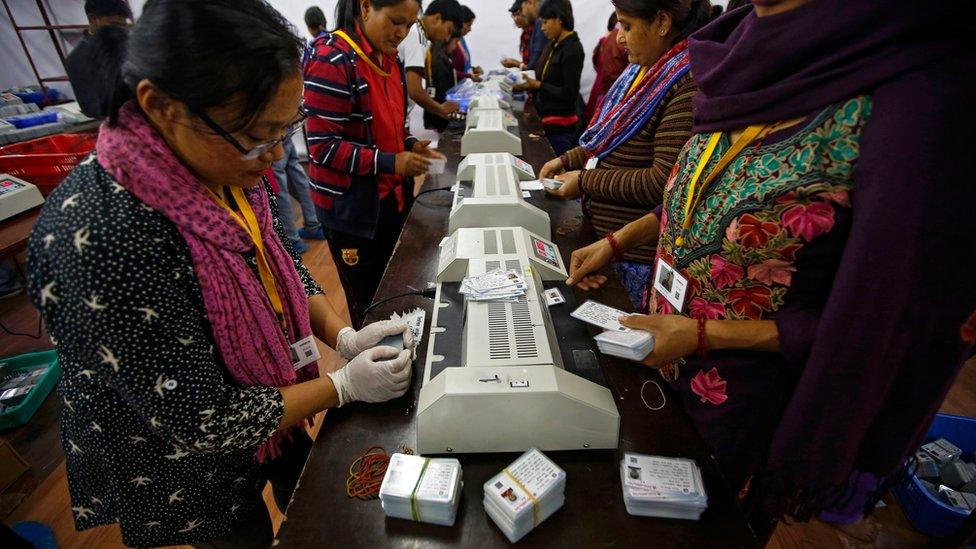 Officials prepare voters identity cards at election commission in Kathmandu