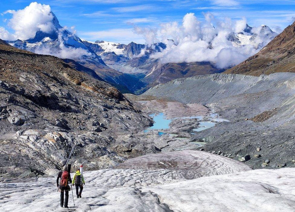 Glaciologists climb over the collapsed tongue of the Findel Glacier (Valais).