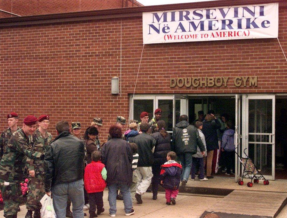 US soldiers welcome Kosovar refugees in 1999