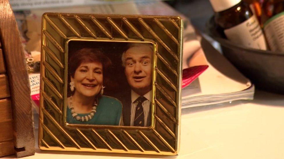 A framed photo of David Parry-Jones and Beti George