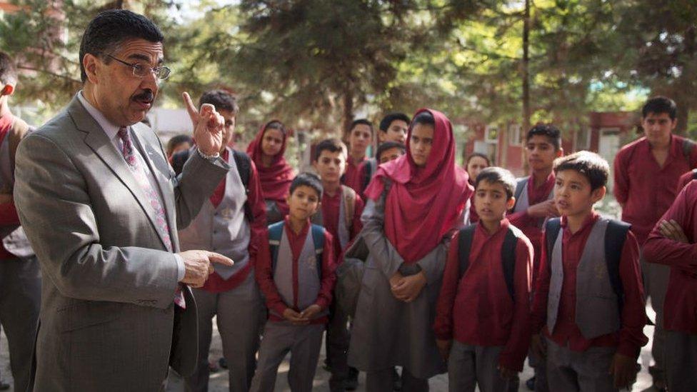 Ahmad Sarmast, left, Director of the Afghan National Institute of Music, warns students to take security precautions in the wave of a suicide attack September 6, 2016 in Kabul