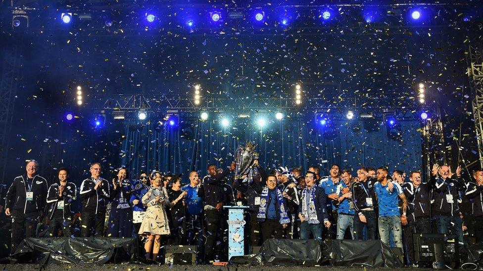 Leicester City show the trophy to the fans during the celebrations at Victoria Park