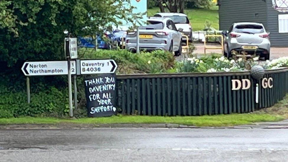 Road signage with Daventry Banksie sign underneath