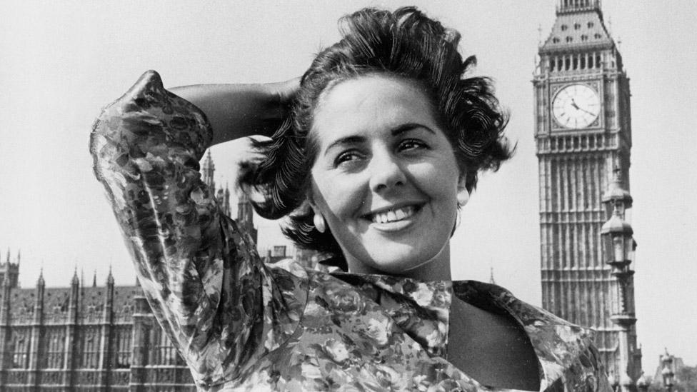 Betty Boothroyd outside the Houses of Parliament in 1959