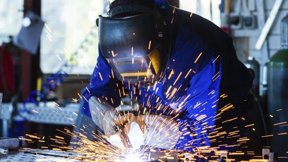 Welder with sparks flying