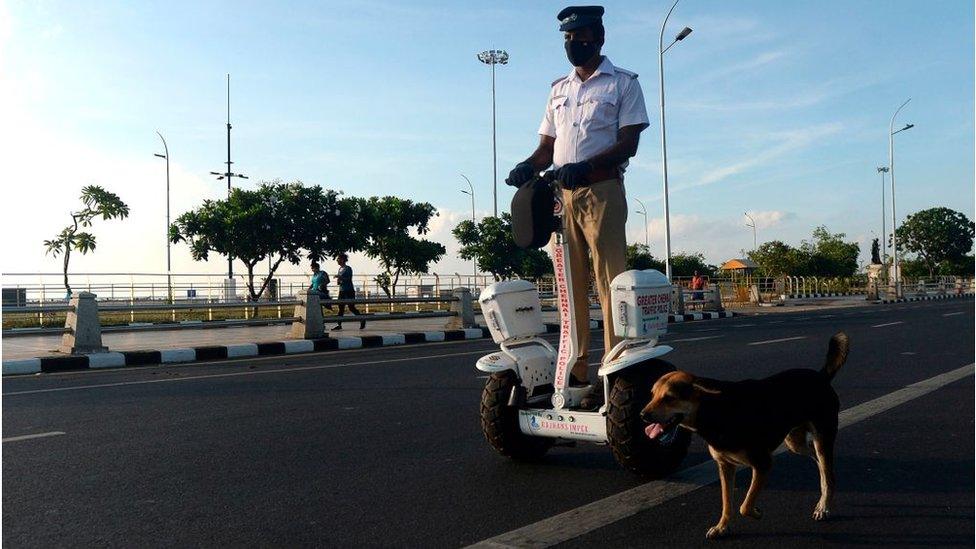 A traffic police officer rides a self-balancing scooter in Chennai