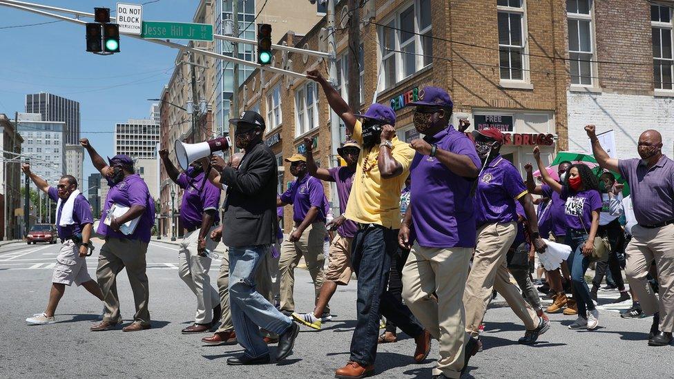 Image shows Crump leading a march in Atlanta, Georgia