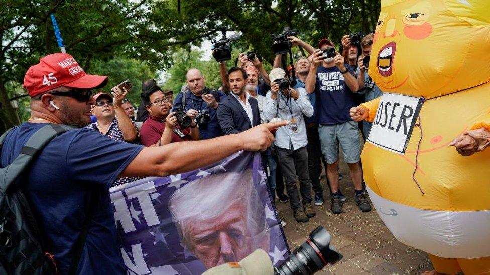 Demonstrators outside court for Donald Trump's arraignment in Washington DC on 3 August 2023