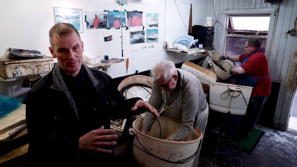 Fishermen using traditional hook and line method