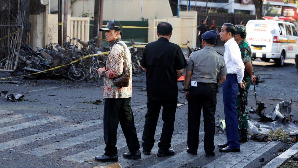 Indonesian President Joko Widodo (R) visited the bombed Surabaya Centre Pentecostal Church on 13 May 2018