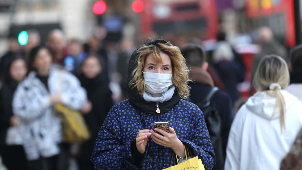 A woman wearing mask