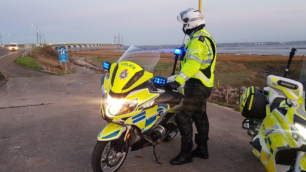 police officer next to motorbike